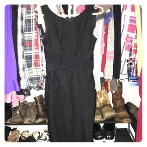 Black sleeveless figure fitting dress